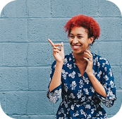 Person expressing joy in a public space.